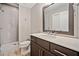Bathroom with dark vanity and shower at 228 Dawson Dr, Woodstock, GA 30188