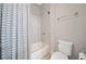 Clean bathroom with tub, shower, and striped curtain at 228 Dawson Dr, Woodstock, GA 30188