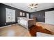 Spacious bedroom with hardwood floors and a large window at 228 Dawson Dr, Woodstock, GA 30188