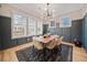 Elegant dining room with hardwood floors, wood table, and stylish chandelier at 228 Dawson Dr, Woodstock, GA 30188