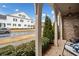 Brick front porch with arched entryway, offering a welcoming view of the neighborhood at 228 Dawson Dr, Woodstock, GA 30188