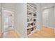 Built-in shelving adds storage and style to this hallway at 228 Dawson Dr, Woodstock, GA 30188