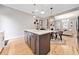 Open concept kitchen with island and hardwood floors at 228 Dawson Dr, Woodstock, GA 30188