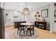 Modern eat-in kitchen with island, white cabinets, and hardwood floors at 228 Dawson Dr, Woodstock, GA 30188