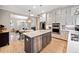 Modern kitchen features island, stainless steel appliances, and white cabinets at 228 Dawson Dr, Woodstock, GA 30188