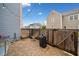 View of a fenced patio with brick pavers and string lights at 228 Dawson Dr, Woodstock, GA 30188