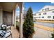 Covered porch with seating area and view of the street at 228 Dawson Dr, Woodstock, GA 30188