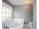 Relax in this bathroom's luxurious oval soaking tub at 3581 Baywater Trl, Snellville, GA 30039