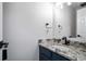Modern bathroom with granite countertop, black faucet, and white sink at 3581 Baywater Trl, Snellville, GA 30039