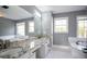 Bathroom boasts granite countertops and double sinks at 3581 Baywater Trl, Snellville, GA 30039