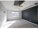 Spacious bedroom with carpeted floors, tray ceiling, and large window at 3581 Baywater Trl, Snellville, GA 30039