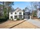 Two-story house with white brick, gray accents, and a two-car garage at 3581 Baywater Trl, Snellville, GA 30039
