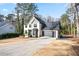 Two-story house with white brick, gray accents, and a two-car garage at 3581 Baywater Trl, Snellville, GA 30039