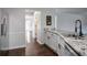 Modern kitchen with granite countertops, double sink, and stainless steel appliances at 3581 Baywater Trl, Snellville, GA 30039