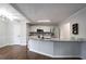 Modern kitchen with granite island, white cabinets, and stainless steel appliances at 3581 Baywater Trl, Snellville, GA 30039
