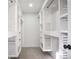 Large walk-in closet with built-in shelving and drawers at 3581 Baywater Trl, Snellville, GA 30039