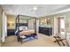 Large main bedroom with a four-poster bed, sitting area, and ensuite bathroom at 1106 Fairway Ne Gdns, Atlanta, GA 30319