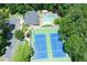 Aerial view of community pool, tennis courts, and clubhouse at 24 Muncy Se Ct, Smyrna, GA 30080