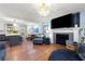 Open living room with hardwood floors and a view into the updated kitchen at 2673 Mountain Brook Rd, Canton, GA 30114