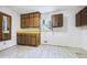 Laundry room with wood cabinets and yellow countertop at 4275 Blackland Dr, Marietta, GA 30067