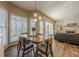 Bright dining area with hardwood floors and view of the living room at 4975 Cinnabar Dr, Alpharetta, GA 30022