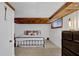 Basement bedroom with a bed, dresser, and tiled floor at 257 Regal Nw Dr, Lawrenceville, GA 30046