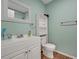 Basement bathroom with white vanity, toilet and shower at 293 Quail Run, Roswell, GA 30076