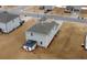 Aerial view showcasing home's rear and side yard at 337 Amsterdam Way, Hampton, GA 30228