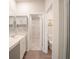 Bathroom with double vanity, walk-in shower, and toilet at 337 Amsterdam Way, Hampton, GA 30228