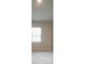 Spacious bedroom with a window and neutral decor at 337 Amsterdam Way, Hampton, GA 30228