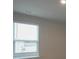 Simple bedroom with neutral walls and window blinds at 337 Amsterdam Way, Hampton, GA 30228