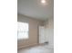 Well-lit bedroom with window and access to bathroom at 337 Amsterdam Way, Hampton, GA 30228