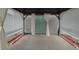 Covered patio with tiled floor and neutral curtains at 337 Amsterdam Way, Hampton, GA 30228