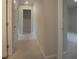 Bright hallway with carpet and access to rooms at 337 Amsterdam Way, Hampton, GA 30228