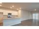 Modern kitchen with granite counters and stainless steel appliances at 337 Amsterdam Way, Hampton, GA 30228