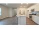 Kitchen features granite countertops and white cabinets at 337 Amsterdam Way, Hampton, GA 30228
