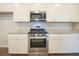 Modern kitchen with stainless steel appliances and granite countertops at 337 Amsterdam Way, Hampton, GA 30228