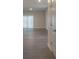 Bright and spacious living room with hardwood floors at 337 Amsterdam Way, Hampton, GA 30228