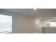 Bright loft area with two windows and carpet at 337 Amsterdam Way, Hampton, GA 30228