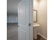 Powder room with pedestal sink and mirror at 337 Amsterdam Way, Hampton, GA 30228