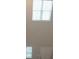 Two-story foyer with tall ceilings and large windows at 337 Amsterdam Way, Hampton, GA 30228