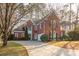 Brick house with a curved driveway and landscaping at 510 Park Creek Rdg, Alpharetta, GA 30005