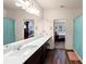 Bright bathroom with double sinks, and a view of the bedroom at 7250 Lacey Dr, Douglasville, GA 30134