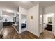 Bright hallway with wood-look floors, leading to bedrooms and bathroom at 7250 Lacey Dr, Douglasville, GA 30134