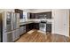 Modern kitchen with dark cabinets, stainless steel appliances, and granite counters at 7250 Lacey Dr, Douglasville, GA 30134