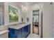 Bathroom with a double vanity, marble countertop, and access to another room at 1170 Oakdale Rd, Atlanta, GA 30307