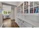 Walk-in pantry with glass-front cabinets and ample storage at 1170 Oakdale Rd, Atlanta, GA 30307