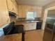 Galley kitchen with white cabinets and granite counters at 2595 Elkhorn Dr, Decatur, GA 30034