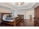 Main bedroom with hardwood floors, large windows, and ensuite bathroom at 2725 Castel Ln, Cumming, GA 30040