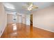 Spacious bedroom with hardwood floors and ceiling fan at 5823 Button Gwinnett Pl, Norcross, GA 30093